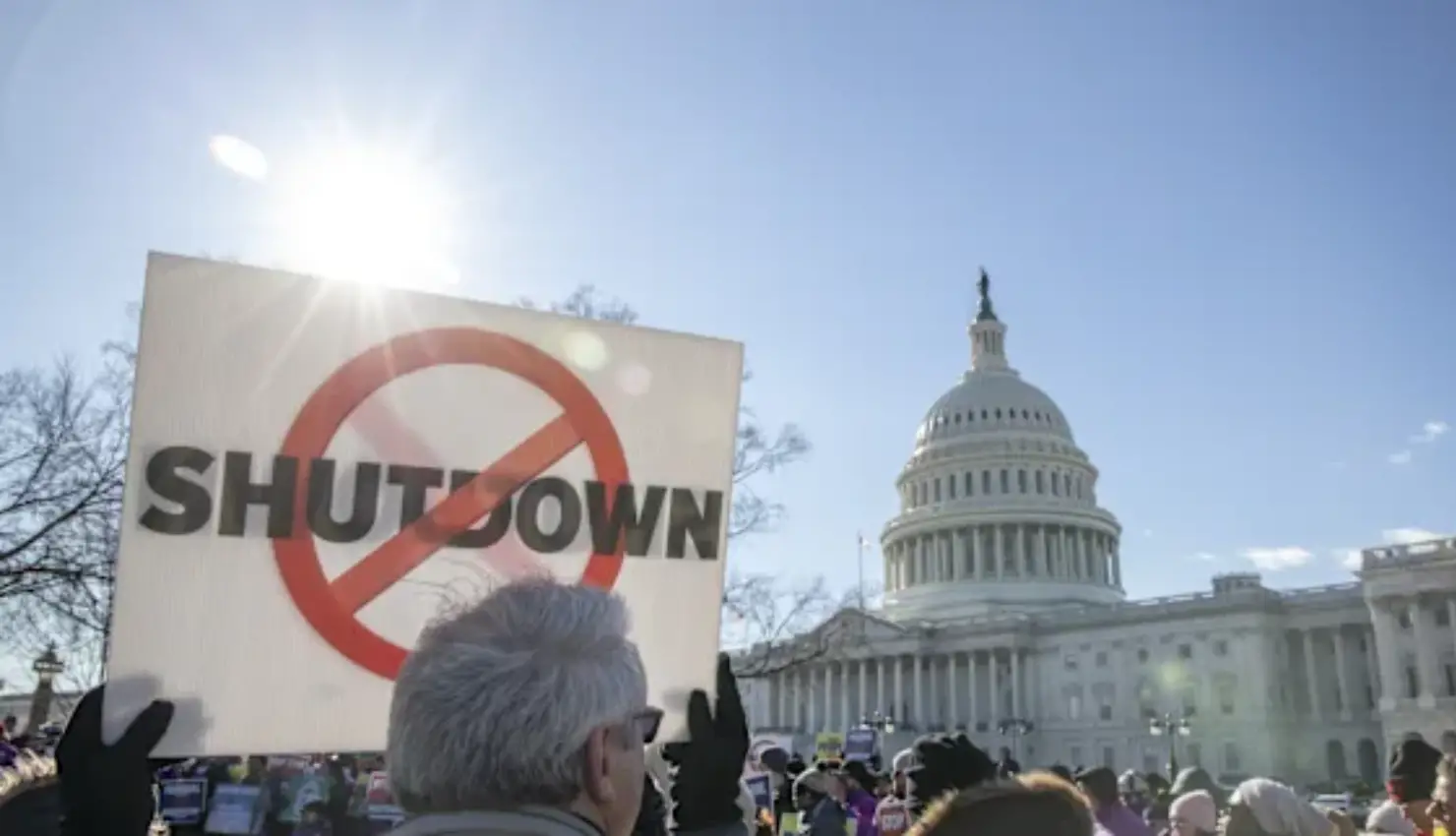 Dow closes at a record high, while Amazon drags down the Nasdaq.
